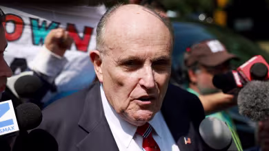 Rudy Giuliani speaks after being booked at Fulton County jail