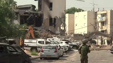 Hundreds of airstrikes bring buildings crashing down in Gaza as gun battles rage in Israel