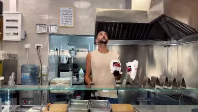 Israeli falafel shop worker juggles iconic street food