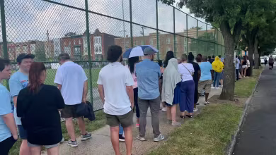 Line to get into rally with Harris and Walz stretches for blocks