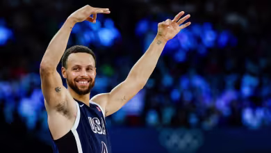 Curry erupts late as U.S. holds off France for gold