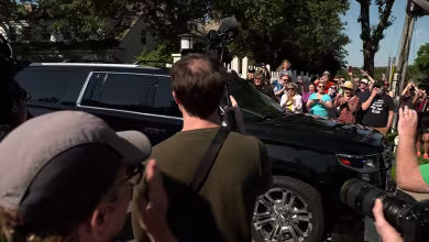 Crowds cheer for Tim Walz as he departs Minnesota home