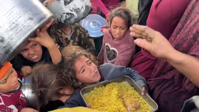 Desperate children struggle for food handouts at Gaza charity kitchen