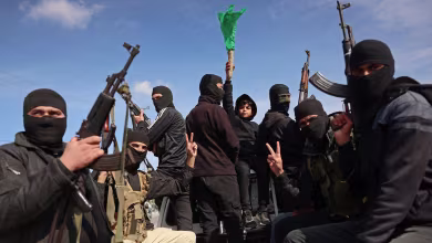 Armed Hamas militants celebrate ceasefire deal in Gaza