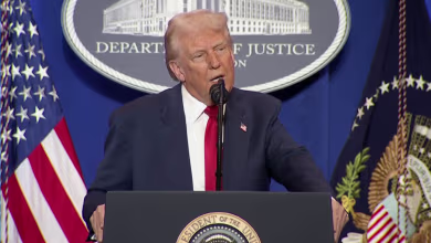 Trump attacks Biden administration in rare visit to Justice Department