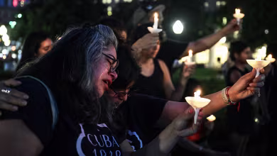 'It's a lot of human suffering': Mourners hold candlelight vigil for Texas flood victims