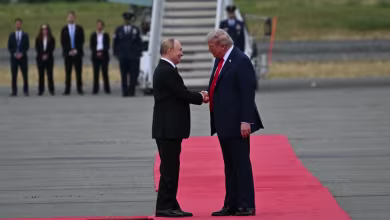 Trump and Putin arrive in Alaska, shake hands on tarmac