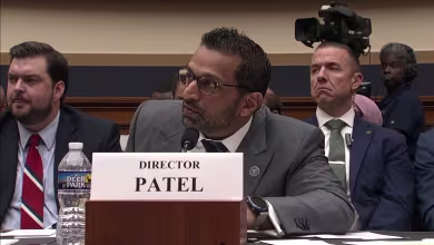 FBI director acknowledges violent extremism on 'both sides'