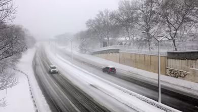 Dangerous road conditions and power outages as blizzard barrels up East Coast