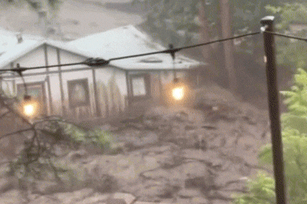 Video showing floodwaters carrying away a house in Ruidoso, New Mexico on July 8, 2025.