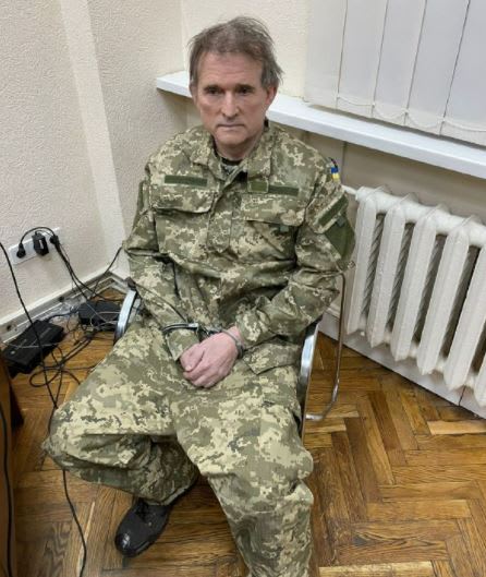 Viktor Medvedchuk, a top pro-Russian politician in Ukraine, wears handcuffs in a picture posted on Ukrainian President Volodymyr Zelenskyy's Telegram account.