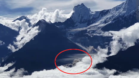 Dust rises from the area of the glacier collapse in Nepal.