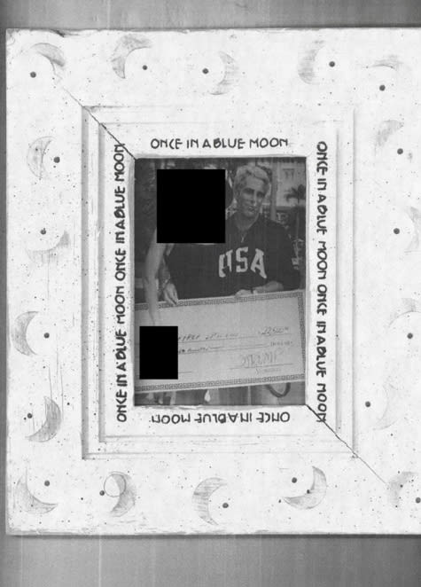 Jeffrey Epstein holds a novelty check.