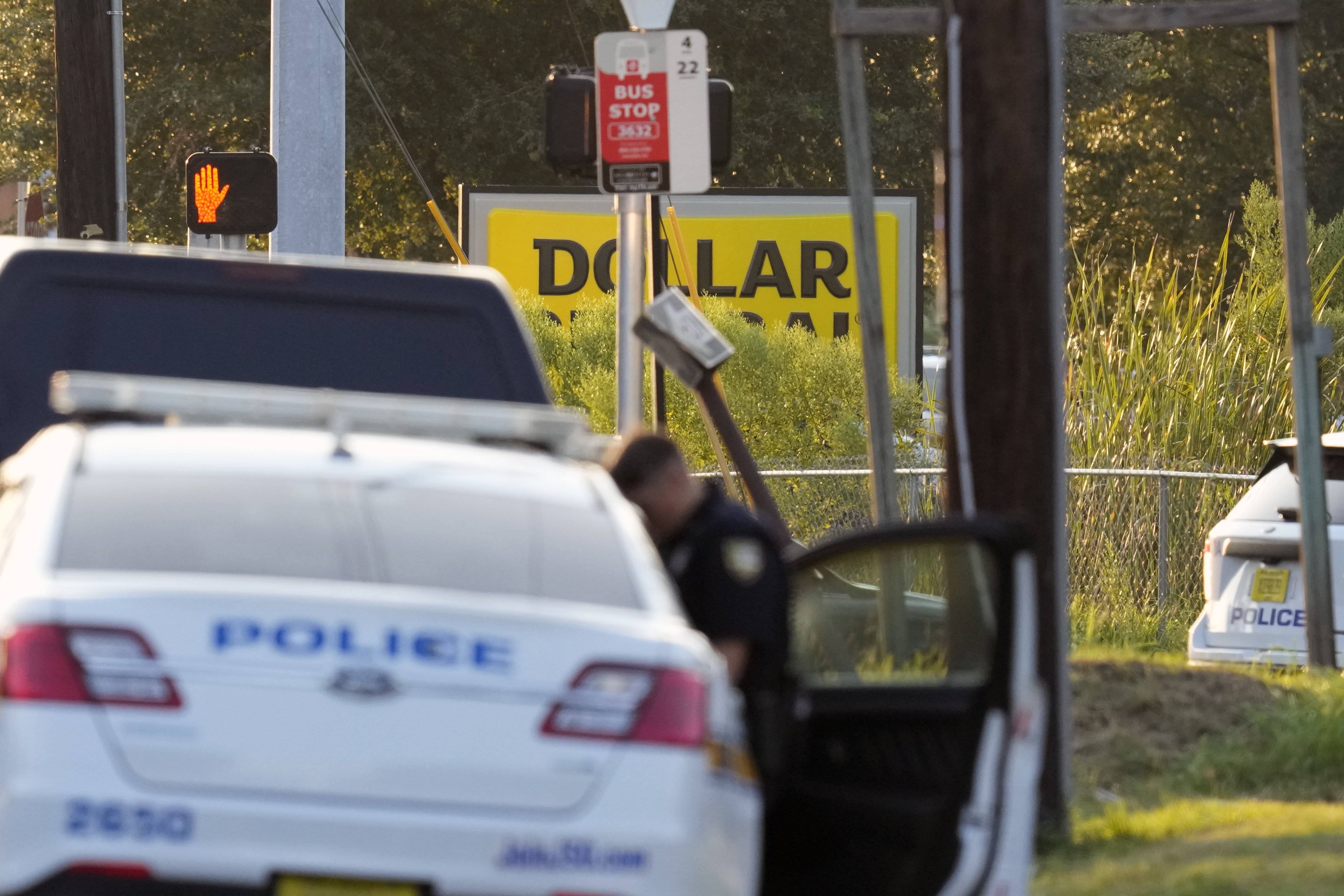 Law enforcement officers investigate the scene of a mass shooting at a Dollar General store Saturday, Aug. 26, 2023, in Jacksonville, Fla. 