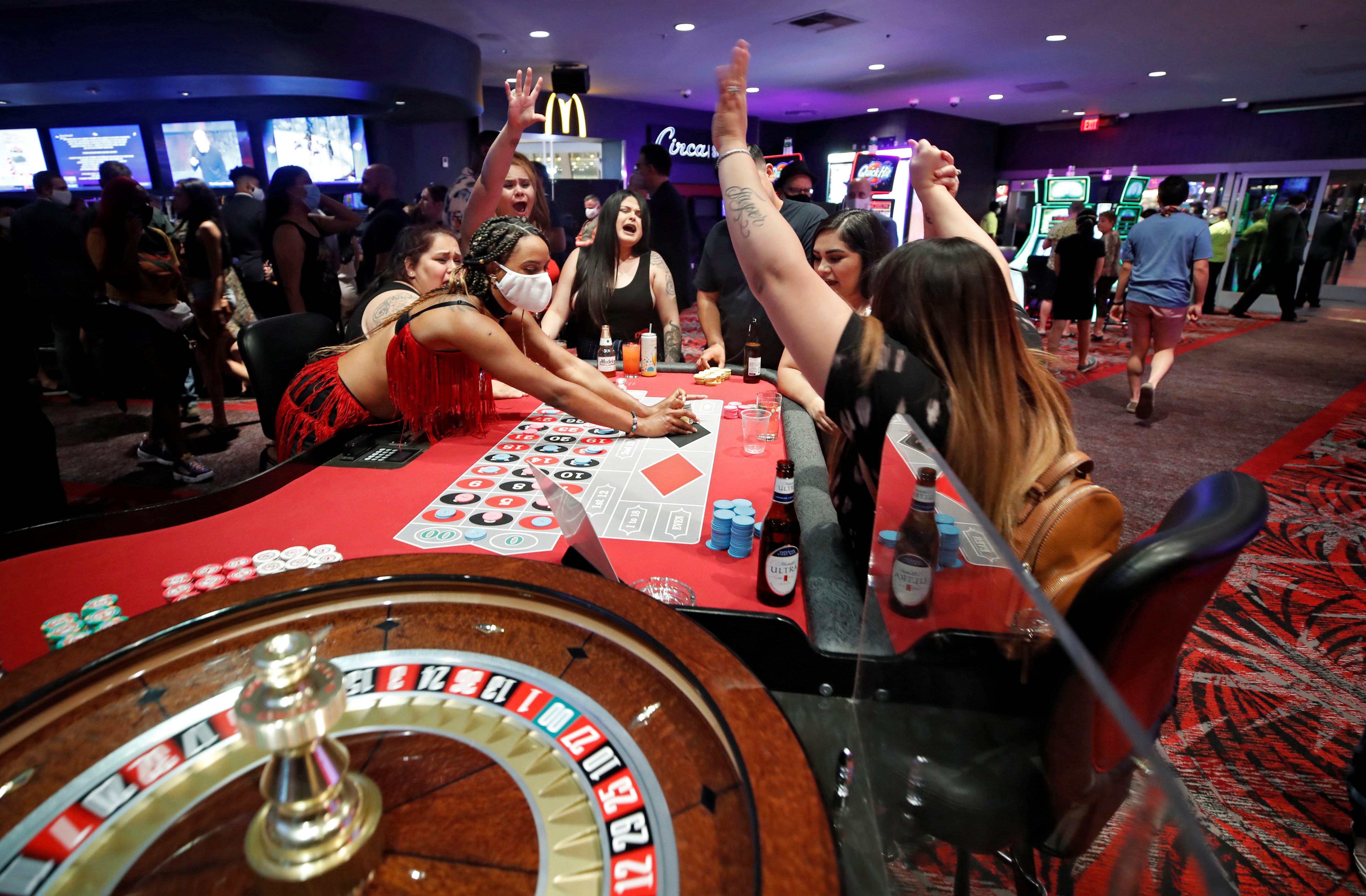 Image: Gamblers celebrate a win while playing roulette during the reopening of The D hotel-casino, closed by the state since March 18, 2020 as part of steps to slow the spread of the coronavirus disease (COVID-19), in downtown Las Vegas