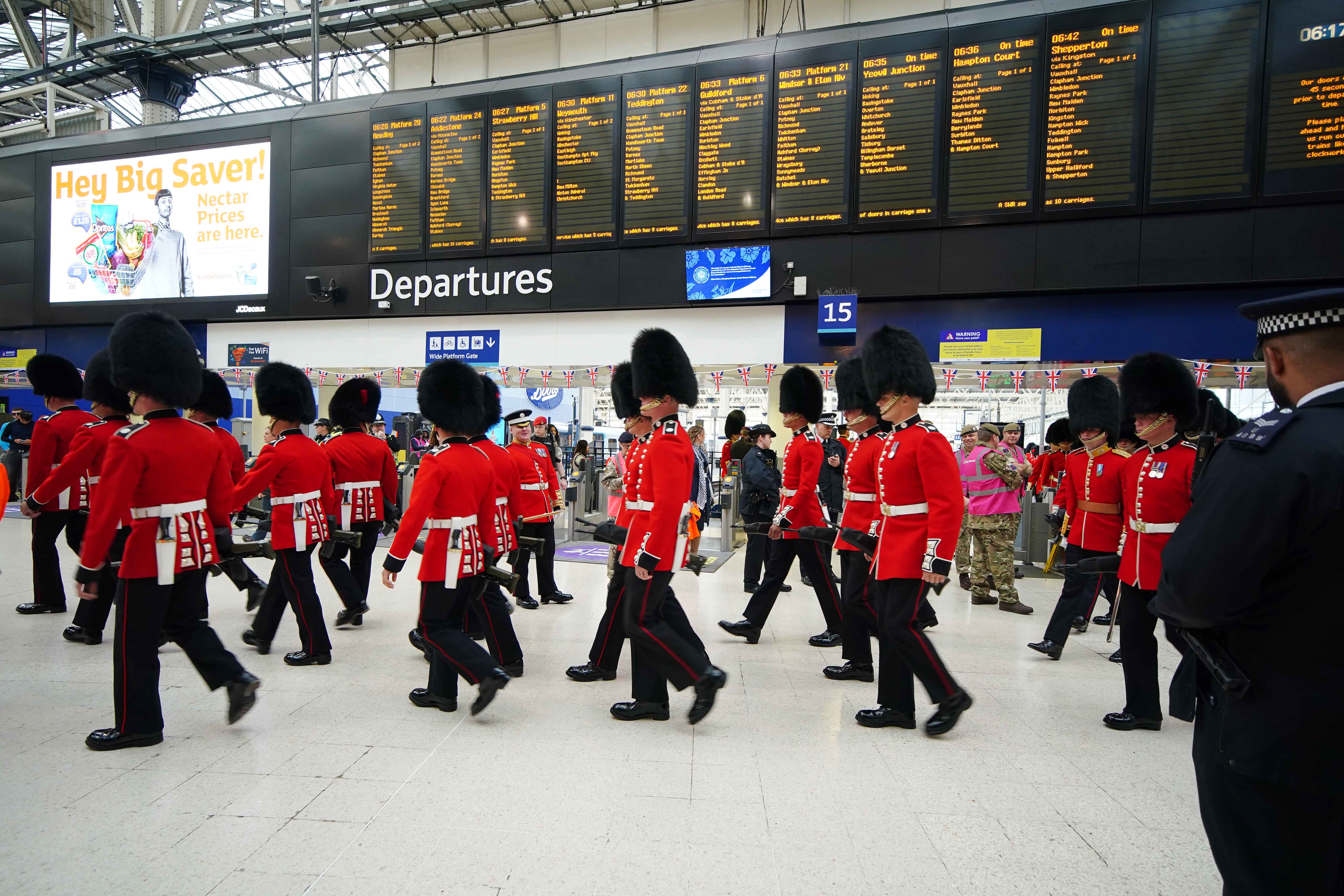 Members of the armed forces taking part in the coronation processions arrive into Waterloo station in London ahead of the coronation of King Charles III and Queen Camilla. Picture date: Saturday May 6, 2023.