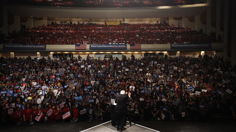Sanders rallies in Texas as entrance polls show him with early Nevada lead