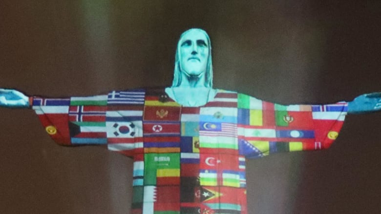 Rio's Christ the Redeemer statue illuminated to show countries afflicted by COVID-19