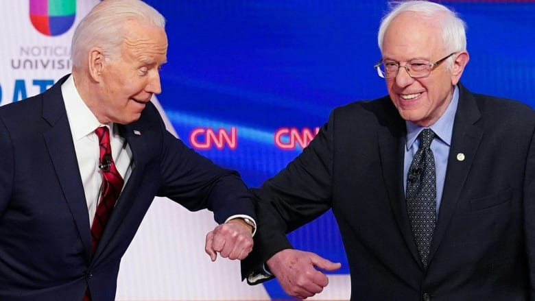Watch Biden, Sanders forgo handshake at debate overshadowed by coronavirus