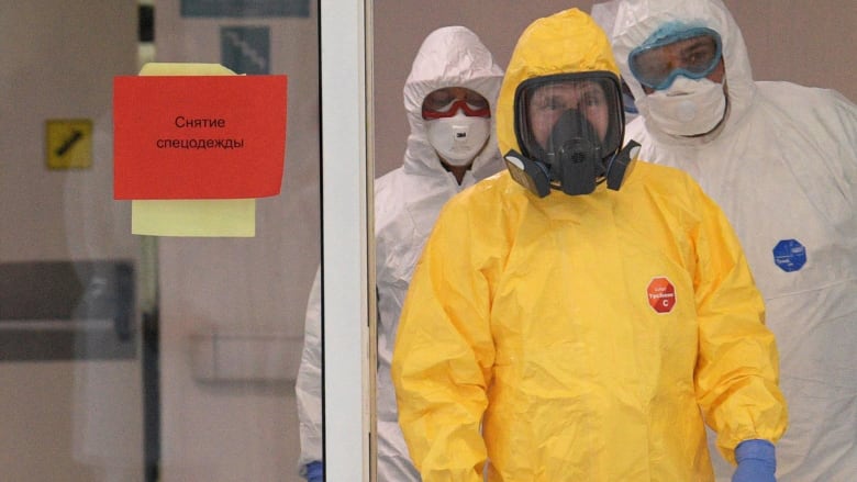 Watch: Putin dons hazmat suit to visit hospital treating coronavirus patients