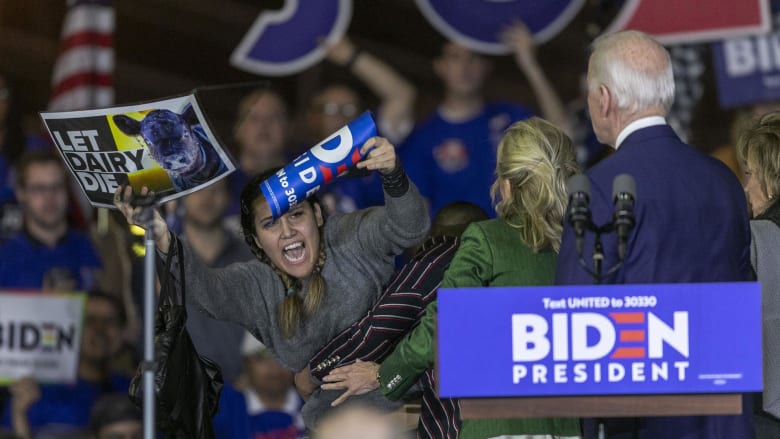 'Let dairy die!' Watch vegan protesters rush stage during Biden