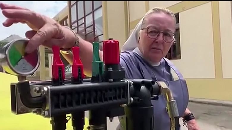 Nun drives farm tractor spreading disinfectant to combat COVID-19