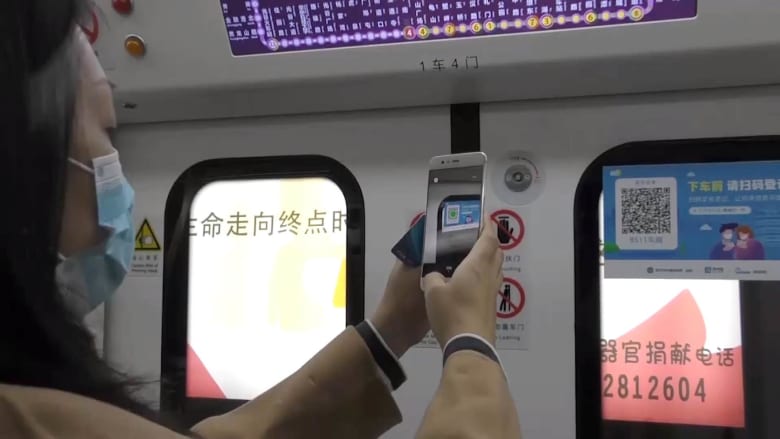 Passengers need more than a ticket to ride Wuhan's subway after COVID-19
