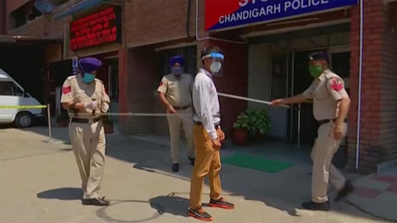Indian police use five-foot pole to social distance while capturing lockdown offenders