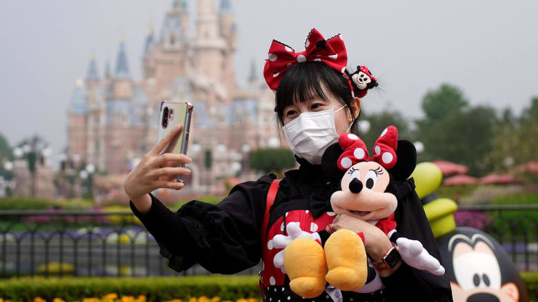 Disneyland Shanghai reopens with dancing, catchy rhythms — and face masks