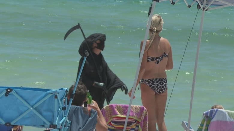 Man dresses as Grim Reaper to warn Florida beachgoers about coronavirus