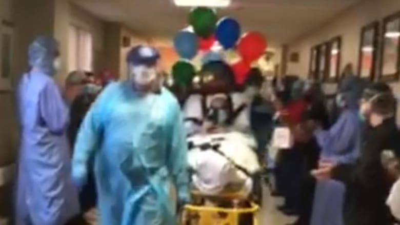 Front line staff cheer on discharged COVID-19 survivor after 44 days in hospital