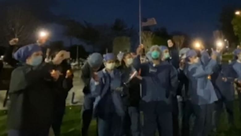 Hospital staff hold candlelight vigil for patients, coworkers lost to COVID-19