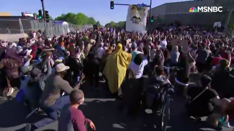 Protesters in Minneapolis take knee, chant names of people who have died at hands of police