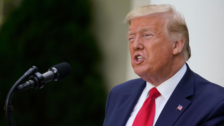 Trump denies criticizing Biden for wearing face mask, asks reporter to take his off