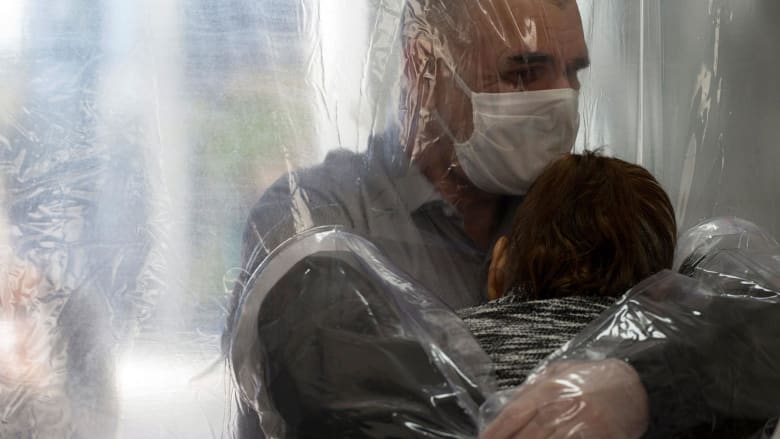 'Cuddle curtain' enables essential hugs despite coronavirus restrictions