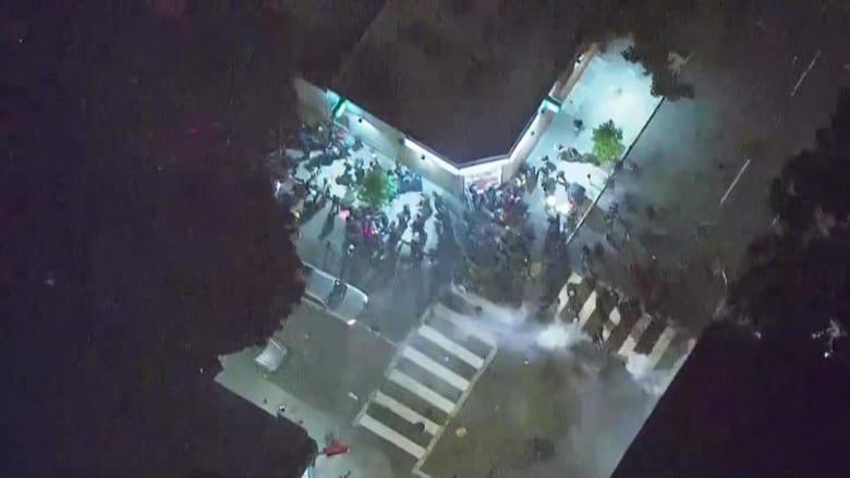 Flash-bang grenades scatter crowd on streets of Portland, Oregon