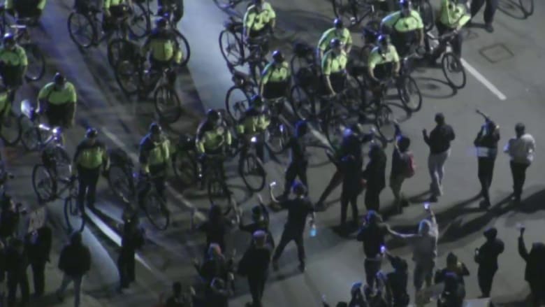 Protesters, bike-mounted police face off in Boston