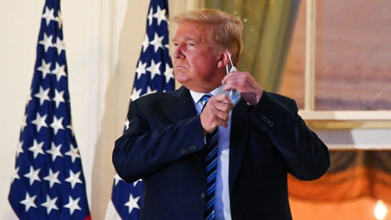 Trump removes mask after returning to White House from Walter Reed