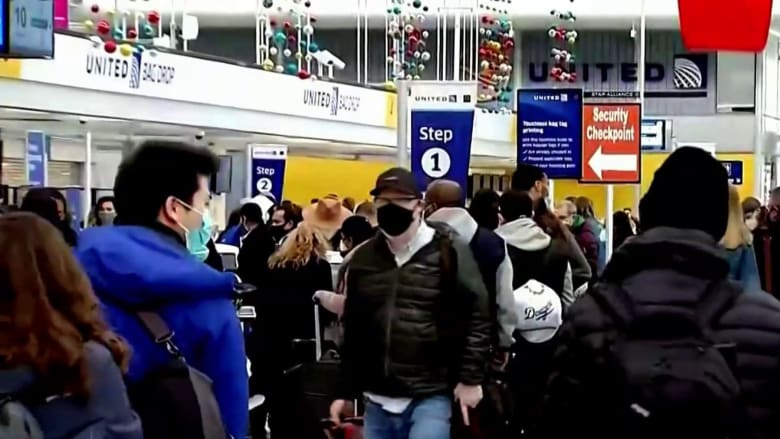 Airports packed with Thanksgiving travelers as Covid-19 cases surge