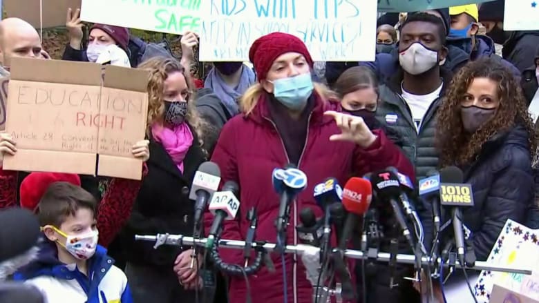 New York City teachers, parents rally at city hall against school shutdown