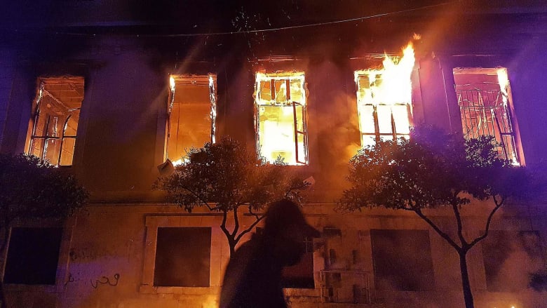 Protesters torch government building over Covid curfew in Lebanon