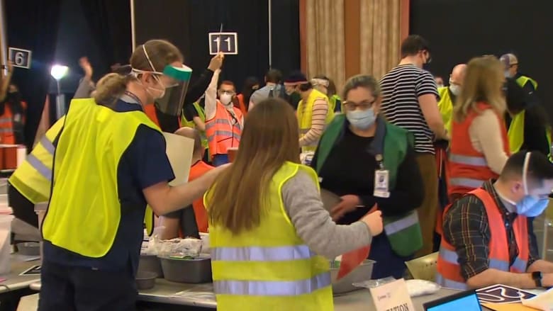 Broken freezer leads to late night rush for Covid vaccinations in Seattle