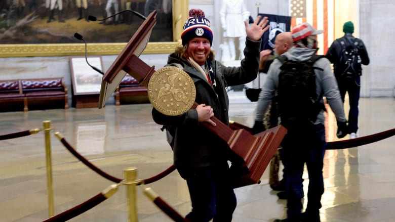 Watch: Man pictured carrying Pelosi’s lectern booked at police station