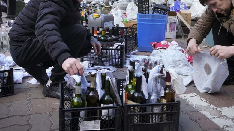 Watch: Kyiv civil defense prepares Molotov cocktails