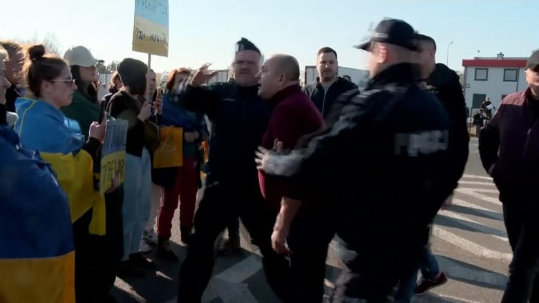 Angry truck drivers confront protesters at Poland-Belarus border