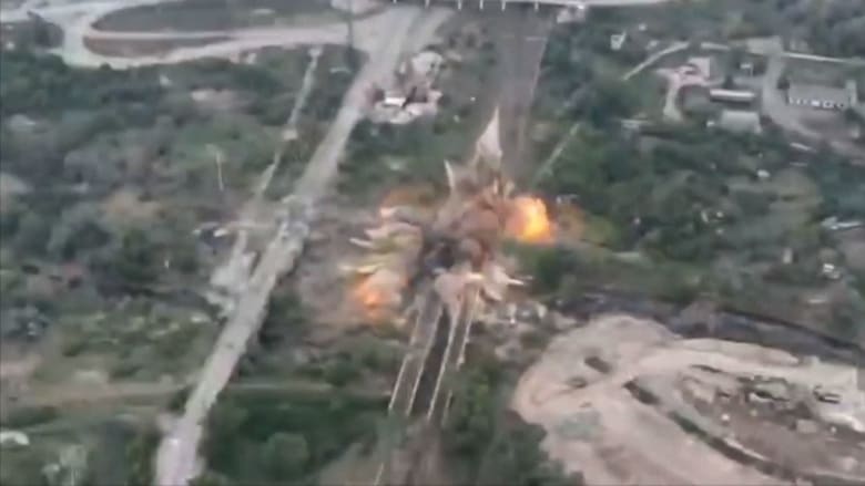 Ukrainian fighters destroy bridge to slow Russian advance