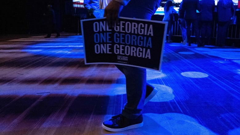 Warnock and Walker advancing to runoff in Georgia Senate race