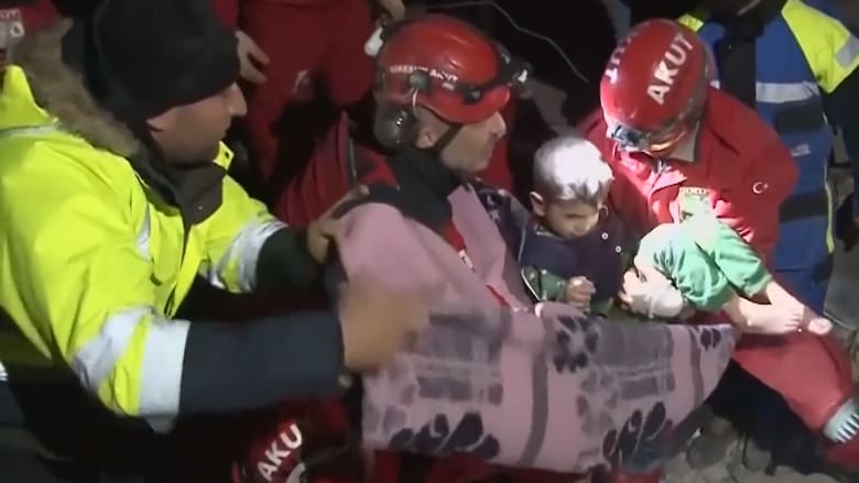 Video shows mom and young son saved from collapsed apartment
