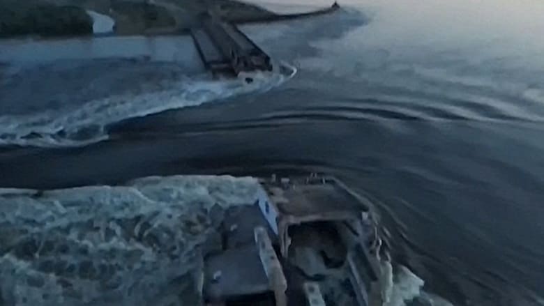 Drone video shows water surging through a huge hole in Ukraine's Kakhovka dam