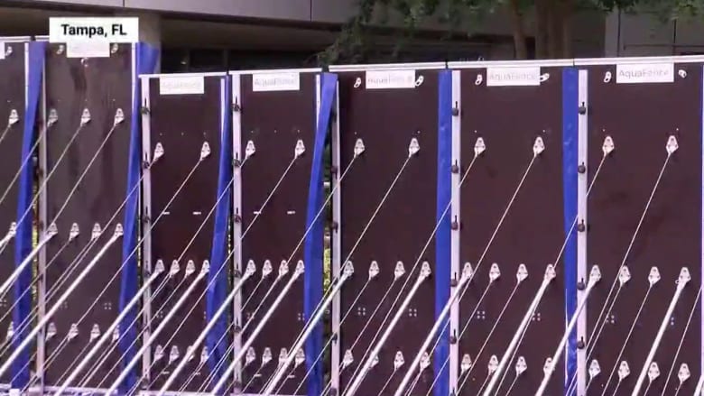 Aqua fences surround Tampa hospital to prevent flooding from Idalia